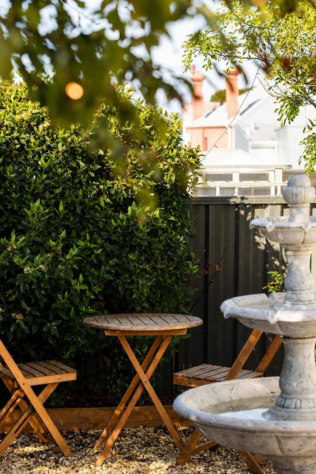 Garden fountain and seating in the rear courtyard
